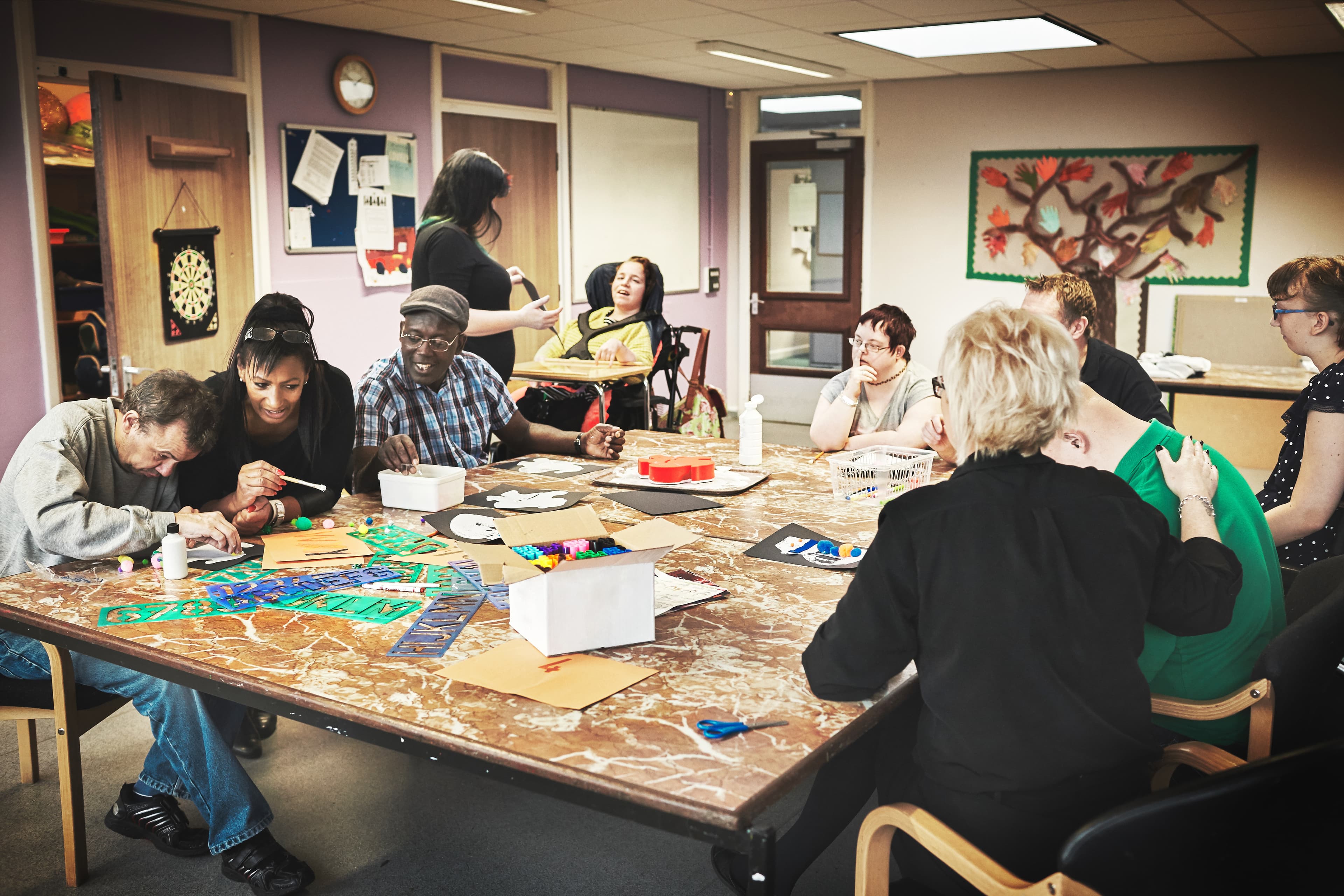 Support worker accompanying NDIS participant in the community