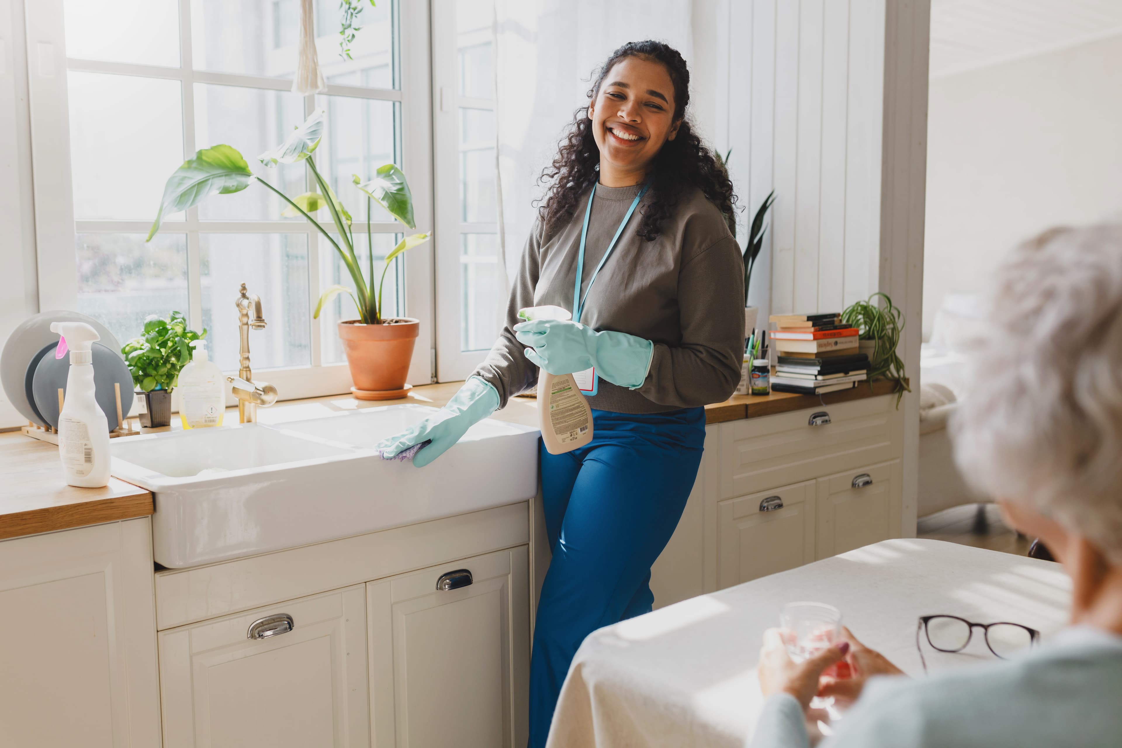 Support worker assisting NDIS participant with laundry and linen tasks